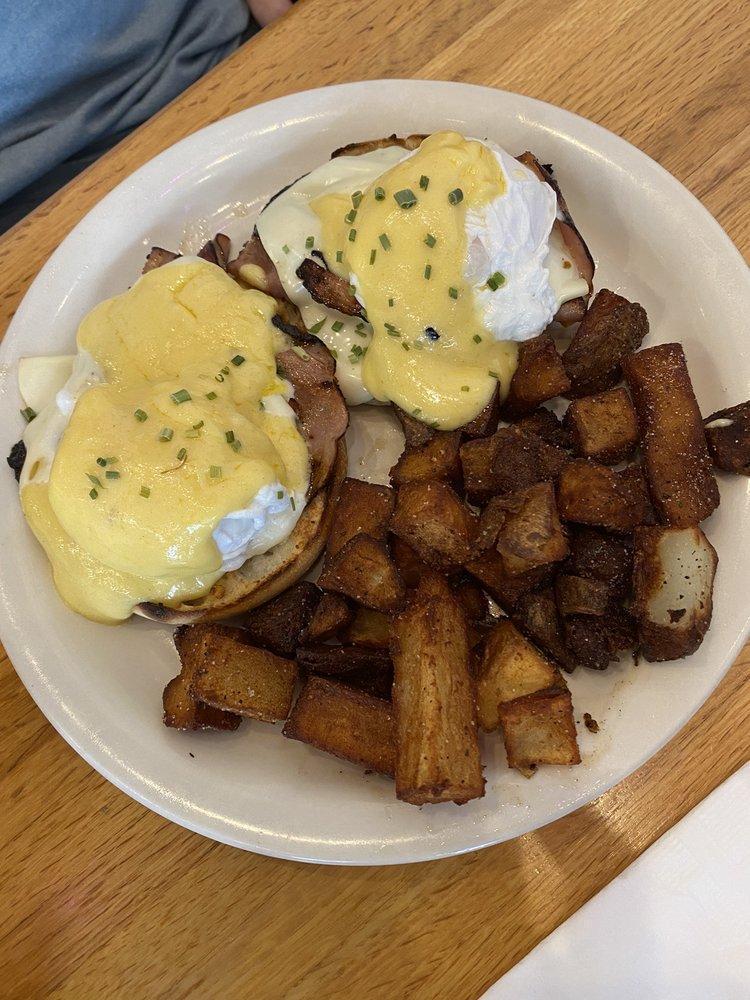 Eggs Benedict · 2 poached eggs, sliced ham, Swiss cheese, and Hollandaise on an English muffin.