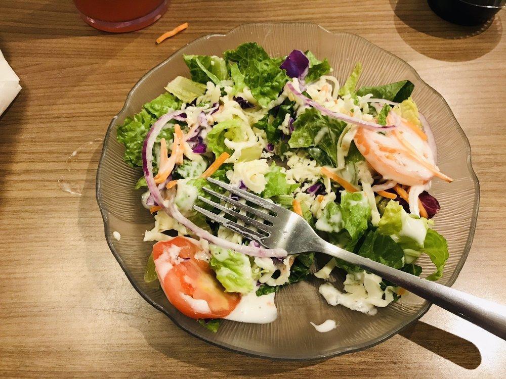 Greek Salad · Feta cheese, pepperoni peppers, imported Kalamata olives served over spring mix and romaine lettuce, Roma tomatoes, red onions, red cabbage and shredded carrots. Served with tangy house-made olive oil and red wine vinegar dressing.
