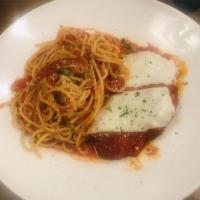 Chicken Parmigiana · Breaded, crisp chicken breast topped with marinara sauce and a generous portion of melted mo...