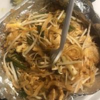 Pad Thai · Stir-fried thin rice noodles with pad Thai sauce, meat, bean sprouts, green onions and egg. ...