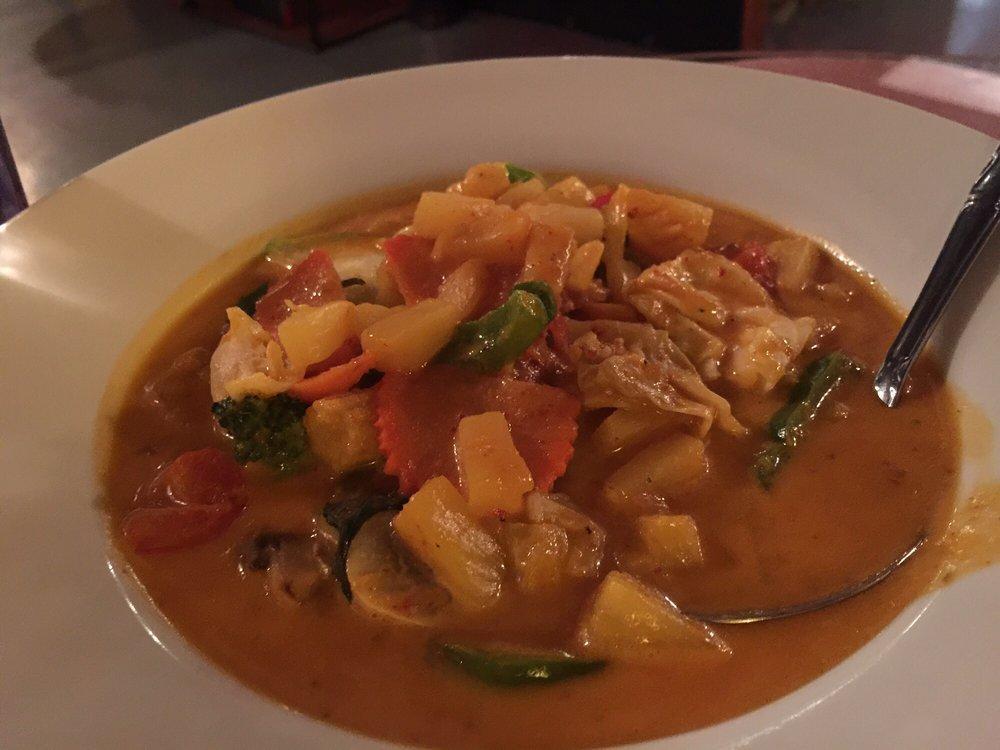 Red Curry · Medium red curry in coconut milk with bamboo shoot, bell peppers, zucchini and Thai basil. Includes steamed jasmine rice.