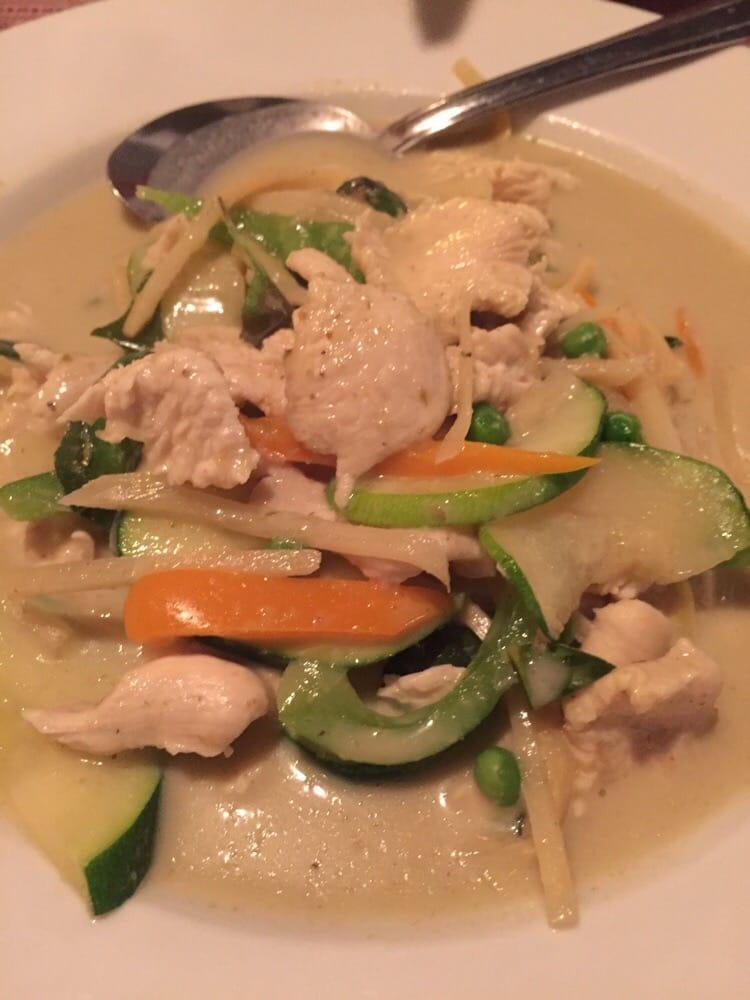 Green Curry · Medium green curry in coconut milk with bell peppers, bamboo shoot, green peas, zucchini and Thai basil. Includes steamed jasmine rice.