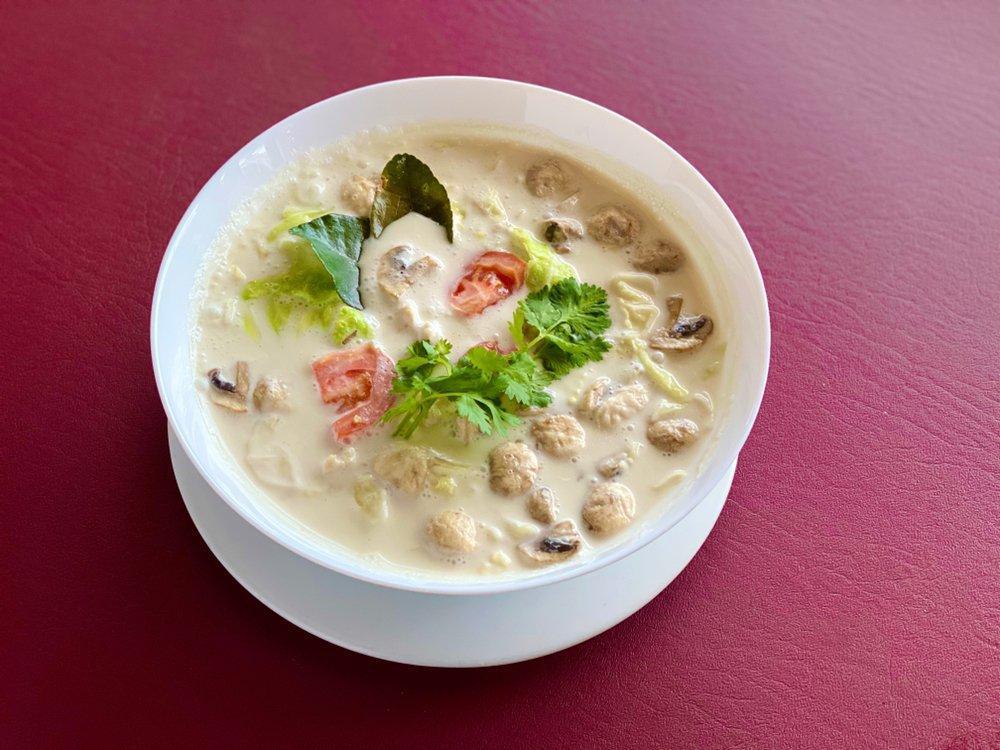 Tom Kha Soup · The most famous hot and sour soup with mushrooms, onions,tomatoes, galangal, kaffir lime leaf and lemongrass.