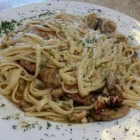 Chicken Marsala · Chicken breast sauteed with mushrooms in our special Marsala wine sauce. Served on a bed of ...