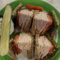 Triple Decker Turkey Club Sandwich · Bacon, lettuce, tomato, mayo on white toast.