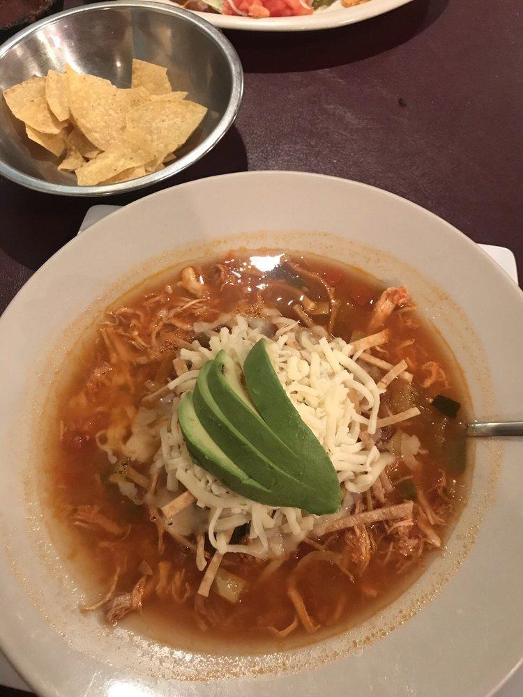 Tortilla Soup · Chicken and vegetables in a homemade broth, topped with tortilla strips, avocado slices, and Jack cheese.