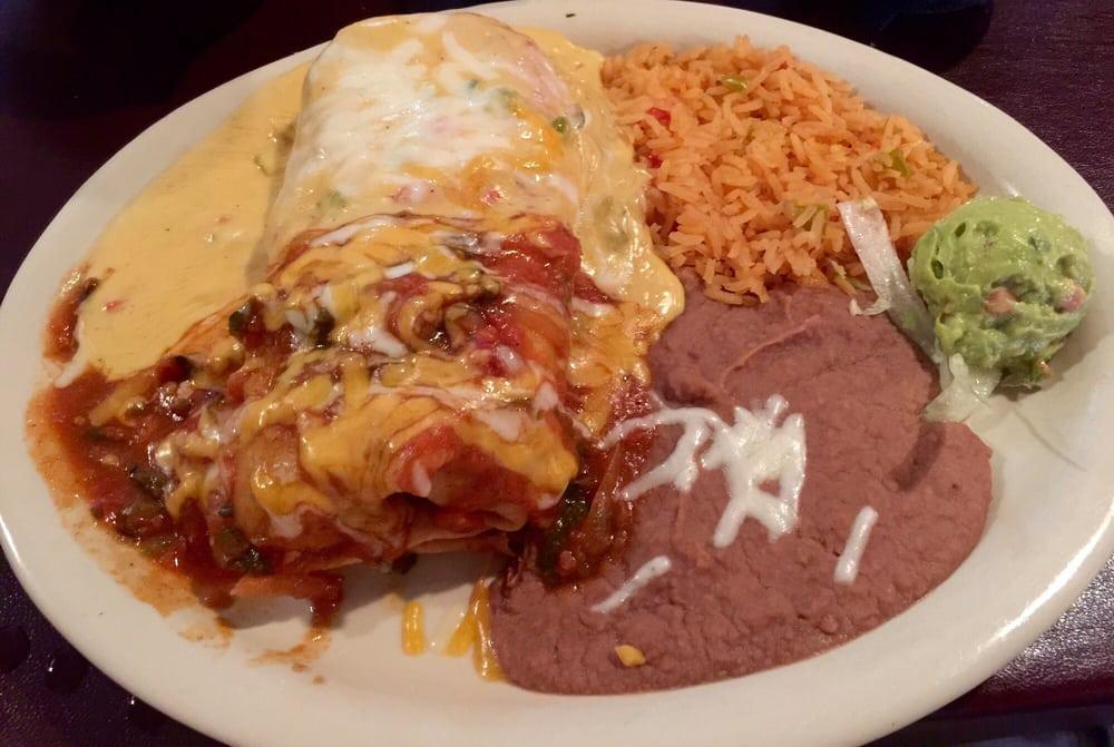 Mushroom Chimichanga · Roasted poblano peppers, grilled onions, sauteed mushrooms, and Jack cheese, covered with ranchero sauce and chile con queso, rice, beans, and guacamole.