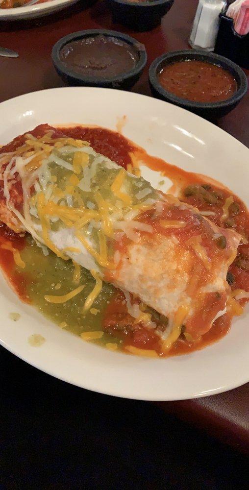 Tres Salsas Burrito · Large flour tortilla stuffed with rice, beans, lettuce, tomatoes, cheese, sour cream and your choice of beef or chicken fajita, topped with tomatillo green sauce, ranchero sauce, and queso sauce.