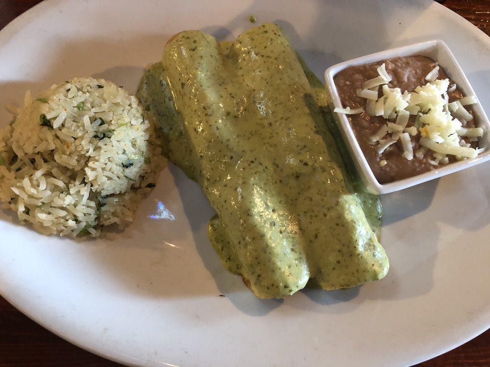 Enchiladas · Choice of 2 chicken, beef, spinach or cheese enchiladas served with rice and refried beans.