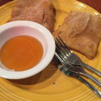 Sopapillas · Two fried puff pastries dusted in cinnamon sugar and served hot with lots of honey.
