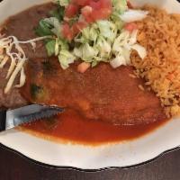 Chiles Rellenos · 2 mild poblano peppers stuffed with cheese and served with shredded lettuce, rice and beans.