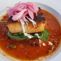 Veracruz Blackened Salmon · Served with olive and caper Veracruz tomato sauce served over jalapeno mozarella risotto cak...