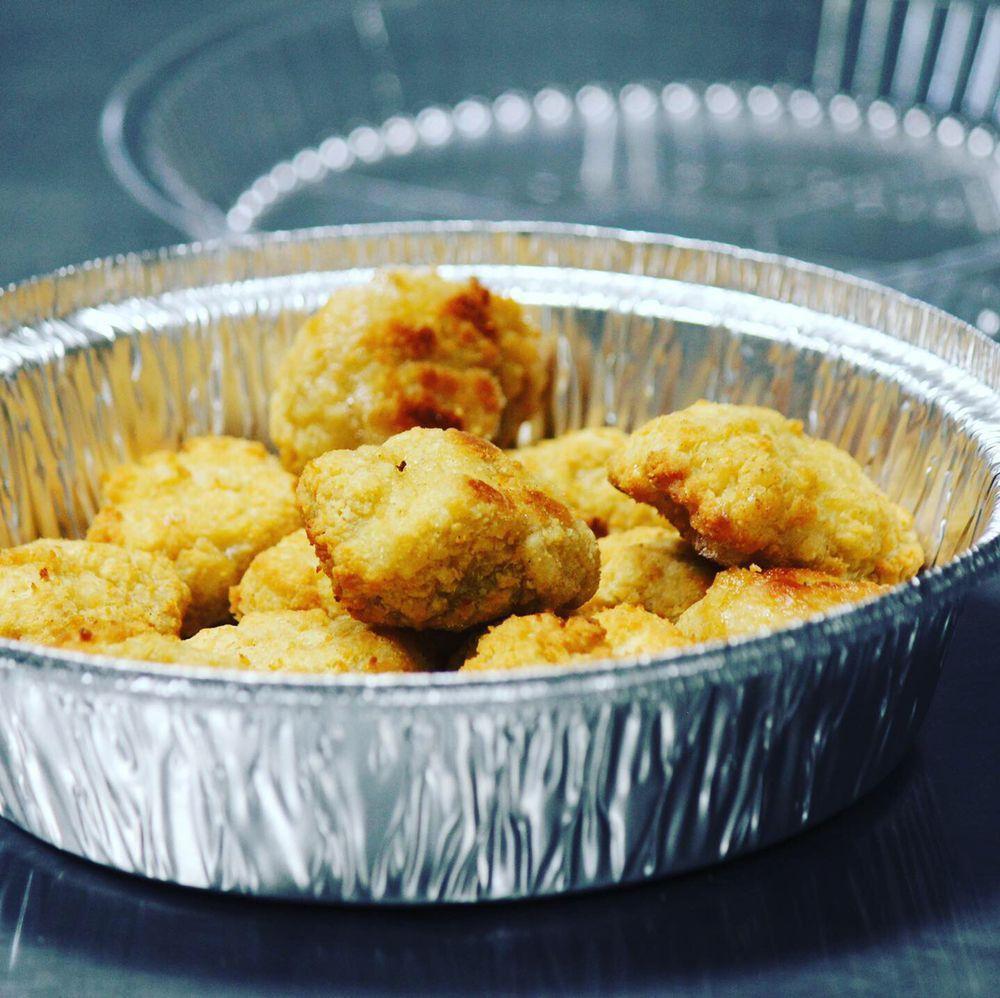 Oven Baked Boneless Wings · Cooked wing of a chicken coated in sauce or seasoning.