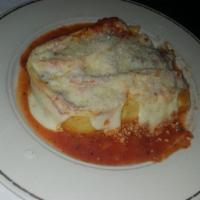 Lasagna · Pasta layered with chunky meat sauce, ricotta and melted mozzarella cheese.