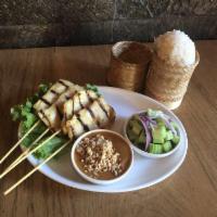 Chicken Satay · Grilled marinated Chicken in skewers. Thai traditional way served with cucumber salad and pe...