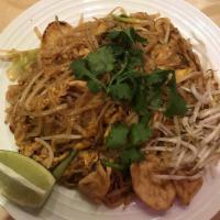 Pad Thai · Thin rice noodles stir fried with tofu, bean sprouts, egg, crushed peanuts and green onions....