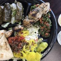 Mediterranean Salad · Greek salad, grilled chicken, and pita.