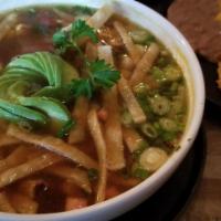 Chicken Tortilla Soup · Seasoned grilled chicken with fresh vegetables served over diced avocados and topped with gr...