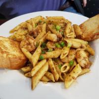 BBQ Shrimp Pasta · New Orleans-style BBQ shrimp tossed with penne pasta, green onions, and garlic. Served with ...