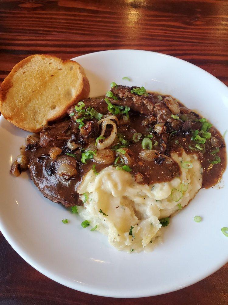 Hamburger Steak · Served with mashed potatoes and gravy and topped with grilled mushrooms and onions.