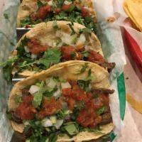 Authentic Street Tacos · 3 soft corn tortillas filled with your choice of meat topped with cilantro, onions and side ...