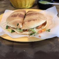 Tortas · Mexican sandwich on a homemade bread. Stuffed with choice of meat, lettuce, tomatoes, onions...