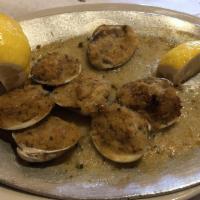 Baked Clams · Whole clams topped with herbed bread crumbs.  