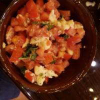Caprese · Chopped fresh mozzarella, tomatoes, sweet basil, salt and Balsamic Vinaigrette