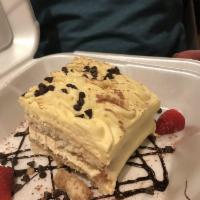 Tiramisu · Mascarpone cream blended with fine Italian liqueur over sponge cake covered by a layer of es...