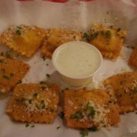Fried Ravioli · Ravioli filled with a blend of spicy cheeses lightly breaded and deep-fried. Served with our...