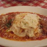 Lasagna · Lasagna layered with a blend of Italian cheeses and sliced Italian sausage. Baked and topped...