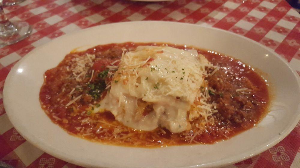 Lasagna · Lasagna layered with a blend of Italian cheeses and sliced Italian sausage. Baked and topped with bolognese sauce. Your Choice of Soup or Salad & Garlic Bread.
