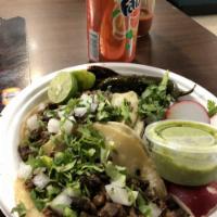 Tacos · 1 delicious taco with your choice of protein, topped with cilantro and onion with a side of ...