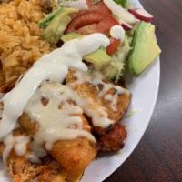 Enchiladas · 3 enchilada combo served with a side of rice, refried pinto beans, salad and topped with let...