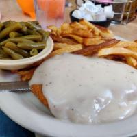Chicken Fried Steak · Our chicken fried steak served with two eggs any style, hash browns and toast or biscuits an...