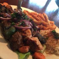 Shish Kabob · Marinated and charbroiled beef tenderloin. Served with rice or fries and soup or salad. Cont...