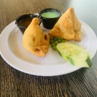 Vegetable Samosa · Pyramid shaped pastry stuffed, potatoes, and spices.