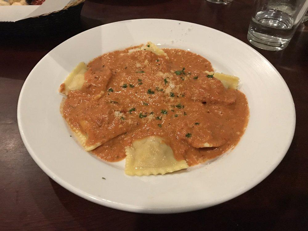 Lobster Ravioli · Lobster ravioli topped with tomato cream sauce and Parmesan cheese. 