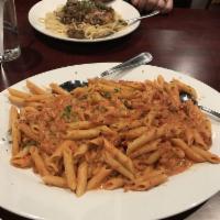 Penne Ala Vodka · Imported semolina pasta tossed in a creamy tomato pink sauce with pancetta and a hint of red...