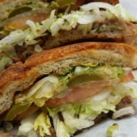 Asada Torta · Torta comes with beans, lettuce,tomatoes, onions, avocado,jalapenos and mayonnaise.