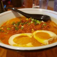 Tan Tan Ramen · Rich pork and chicken broth topped with sauteed cabbage, chopped spring onions, *soft boiled...