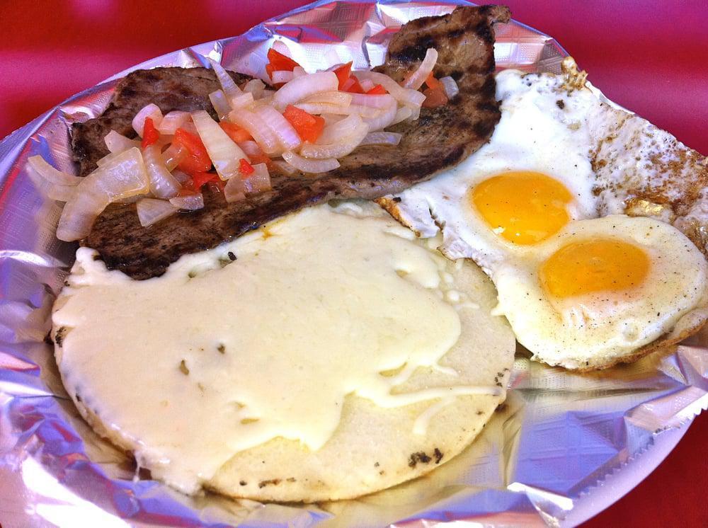 Madrugon · Early morn. Grilled steak, pico de gallo, arepa with mozzarella cheese topping and 2 eggs cooked to taste.