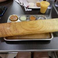 Masala Dosa · Rice and lentil crepe filled with potato curry and served with chutneys