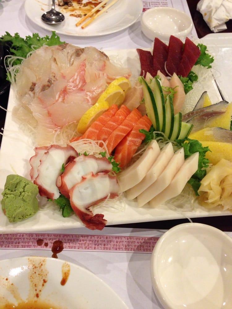 Sashimi · Fluke, salmon, tuna, white tuna- 4 pieces each.