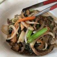 Jap Chae Over Rice · Stir-fried vermicelli noodles with veggies and shredded beef.