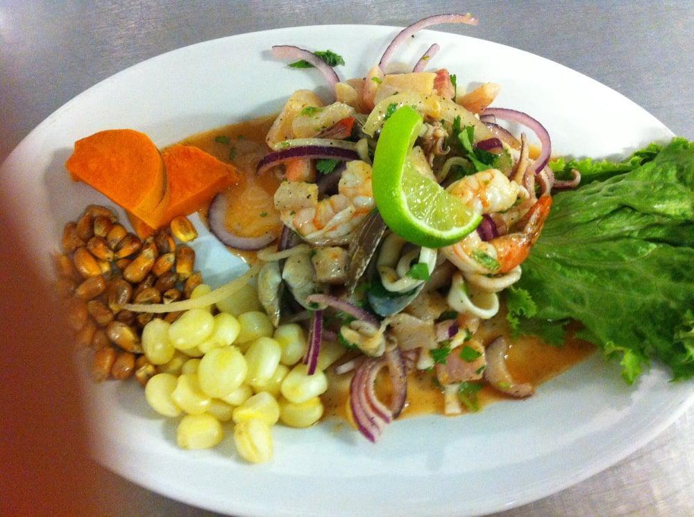 Ceviche Mixto · Fish, calamari and shrimp marinated with lime, red onions, cilantro and aji limo.