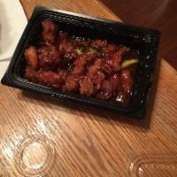 Orange Chicken · Dark meat chicken lightly breaded and fried, then sauteed with pungent orange peels in a swe...