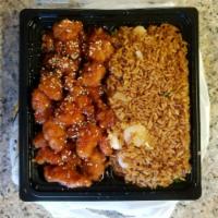 Sesame Chicken · Dark meat chicken lightly breaded and fried, then sauteed in a delectable sauce served with ...