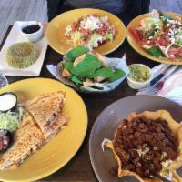 Enchiladas · Corn tortillas around your choice of filling, covered in salsa Verde or salsa roja, jack che...
