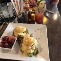 South of the Border Benedict · Poached eggs, English muffin, green chile pulled pork, onions, avocado relish and hollandaise.
